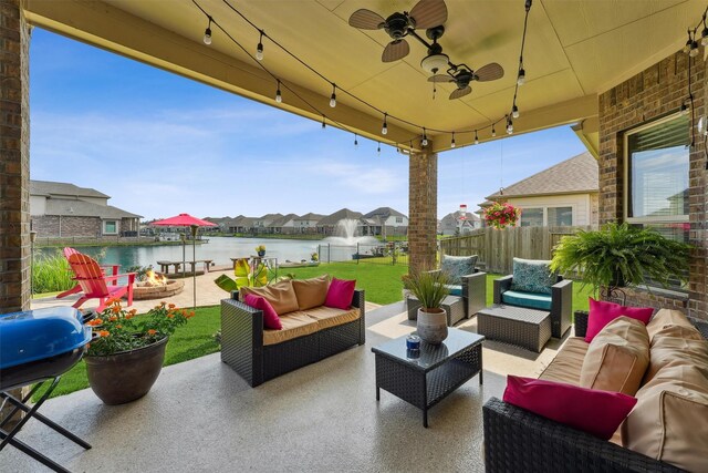3651 Lake Bend Shore Dr, Spring, TX 77386 - view of patio featuring an outdoor living space with a fire pit, a residential view, grilling area, a water view, and a ceiling fan