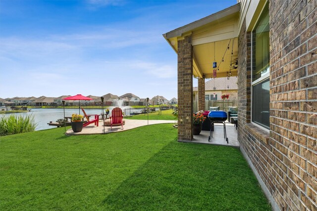 3651 Lake Bend Shore Dr, Spring, TX 77386 - view of yard featuring a patio, a residential view, and a water view