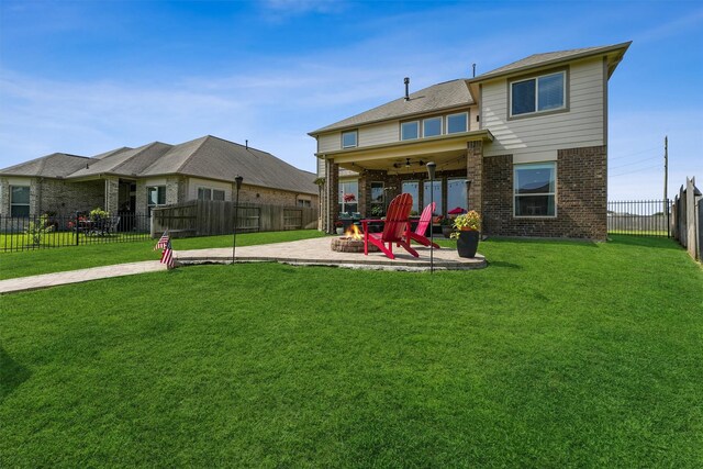 3651 Lake Bend Shore Dr, Spring, TX 77386 - back of property featuring an outdoor fire pit, a patio area, a ceiling fan, and brick siding