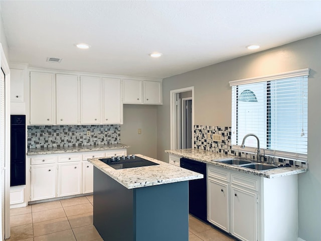 223 Kings Way, Stafford, TX 77477 - kitchen with black appliances, a sink, light tile patterned flooring, decorative backsplash, and a kitchen island