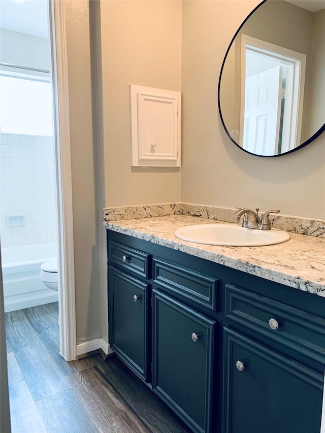 223 Kings Way, Stafford, TX 77477 - full bath featuring vanity, wood finished floors, and toilet