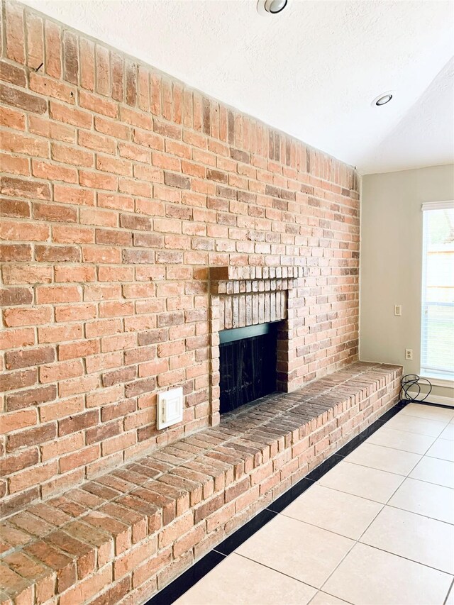 223 Kings Way, Stafford, TX 77477 - detailed view of a fireplace, baseboards, and a textured ceiling