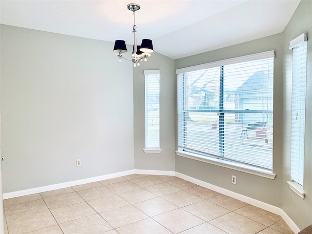 223 Kings Way, Stafford, TX 77477 - empty room with healthy amount of natural light, a chandelier, vaulted ceiling, and baseboards