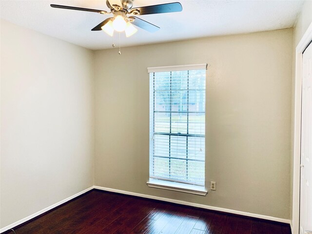 223 Kings Way, Stafford, TX 77477 - unfurnished room with dark wood finished floors, a ceiling fan, and baseboards