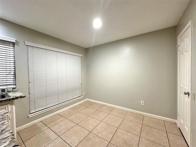 223 Kings Way, Stafford, TX 77477 - unfurnished bedroom with light tile patterned floors and baseboards
