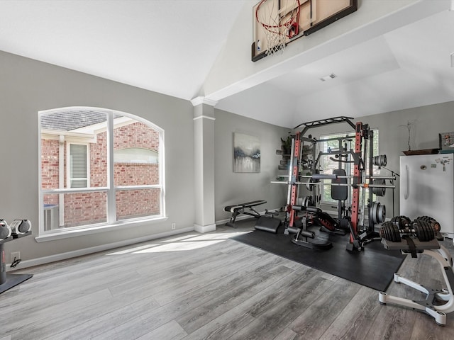 19122 High Canyon Ln, Tomball, TX 77377 - workout room with vaulted ceiling, wood finished floors, and baseboards
