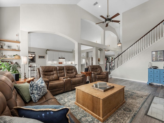 19122 High Canyon Ln, Tomball, TX 77377 - living room with ceiling fan, arched walkways, dark wood-style flooring, and high vaulted ceiling