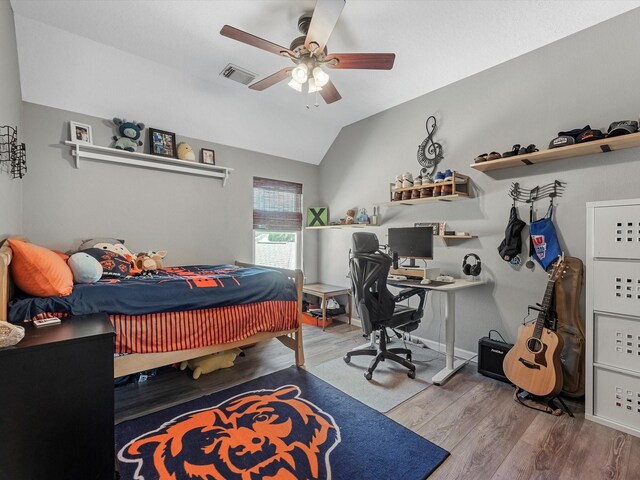 19122 High Canyon Ln, Tomball, TX 77377 - bedroom with wood finished floors, vaulted ceiling, a ceiling fan, a desk, and cooling unit
