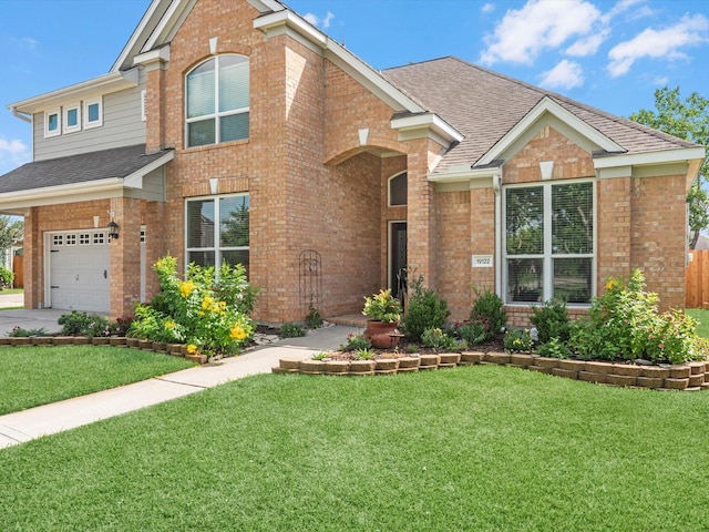 19122 High Canyon Ln, Tomball, TX 77377 - traditional-style home featuring brick siding, a shingled roof, a front lawn, and an attached garage