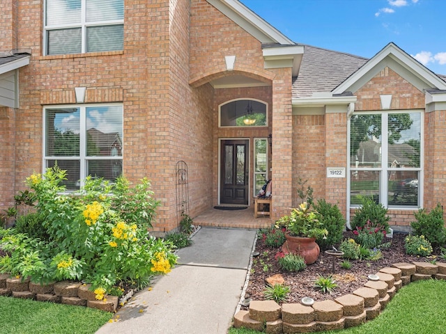 19122 High Canyon Ln, Tomball, TX 77377 - doorway to property with brick siding and a shingled roof