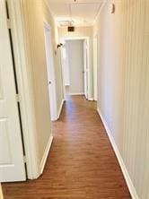 7725 St Lo Rd, Houston, TX 77033 - hallway with wood finished floors and baseboards