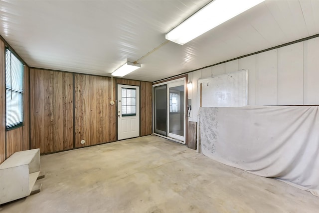 402 E Lambuth Ln, Deer Park, TX 77536 - unfurnished room with unfinished concrete floors and wooden walls