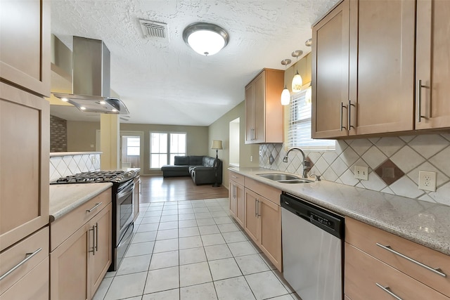 402 E Lambuth Ln, Deer Park, TX 77536 - kitchen featuring appliances with stainless steel finishes, island range hood, a sink, decorative backsplash, and a textured ceiling