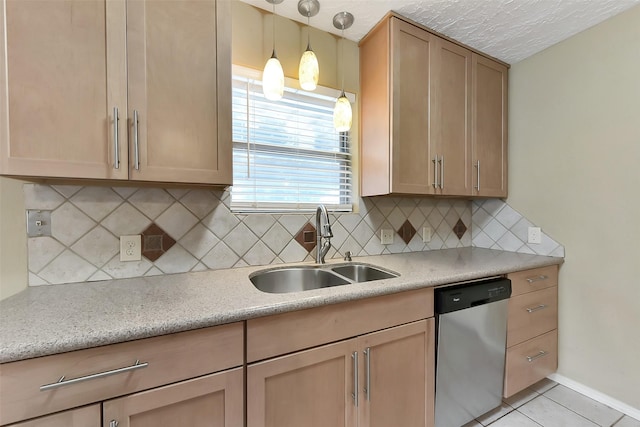402 E Lambuth Ln, Deer Park, TX 77536 - kitchen with dishwasher, a sink, light tile patterned flooring, decorative light fixtures, and decorative backsplash