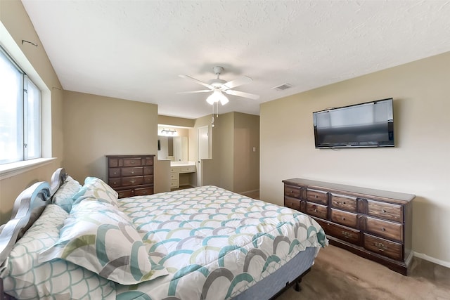 402 E Lambuth Ln, Deer Park, TX 77536 - bedroom featuring carpet, ceiling fan, baseboards, and ensuite bathroom