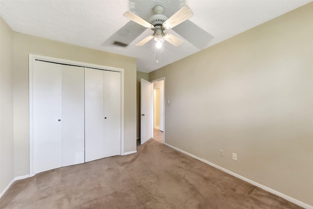 402 E Lambuth Ln, Deer Park, TX 77536 - unfurnished bedroom featuring carpet, baseboards, a closet, and a ceiling fan