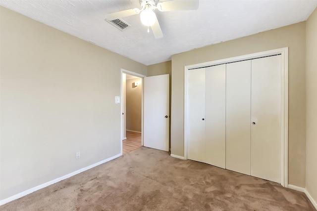 402 E Lambuth Ln, Deer Park, TX 77536 - unfurnished bedroom featuring carpet flooring, baseboards, a closet, and a ceiling fan