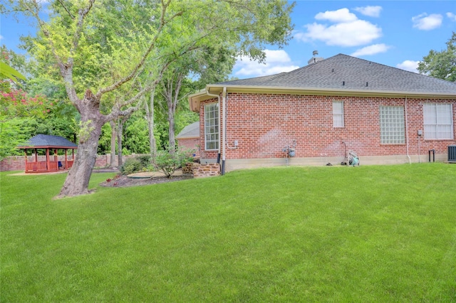 13502 Winter Creek Ct, Houston, TX 77077 - rear view of house featuring a gazebo, a lawn, a shingled roof, brick siding, and cooling unit