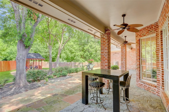 13502 Winter Creek Ct, Houston, TX 77077 - fenced backyard featuring a patio area, ceiling fan, and a gazebo