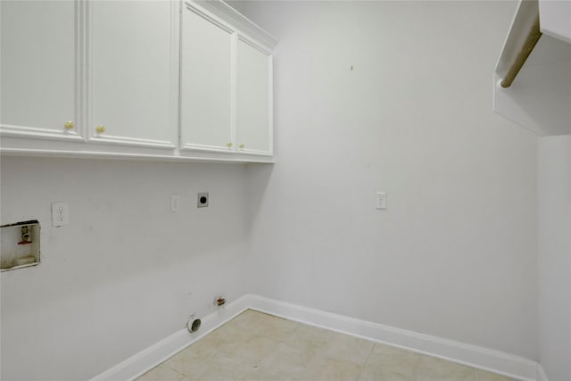 13502 Winter Creek Ct, Houston, TX 77077 - laundry room with hookup for an electric dryer, washer hookup, baseboards, cabinet space, and hookup for a gas dryer