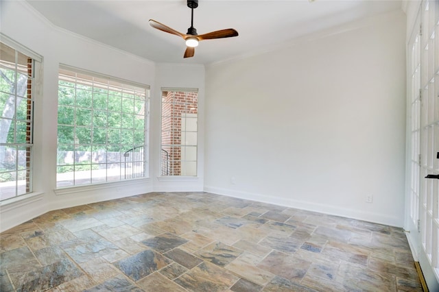 13502 Winter Creek Ct, Houston, TX 77077 - spare room with stone tile floors, ceiling fan, ornamental molding, and baseboards