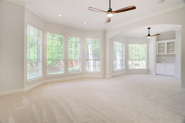 13502 Winter Creek Ct, Houston, TX 77077 - carpeted empty room featuring ceiling fan, ornamental molding, arched walkways, baseboards, and recessed lighting