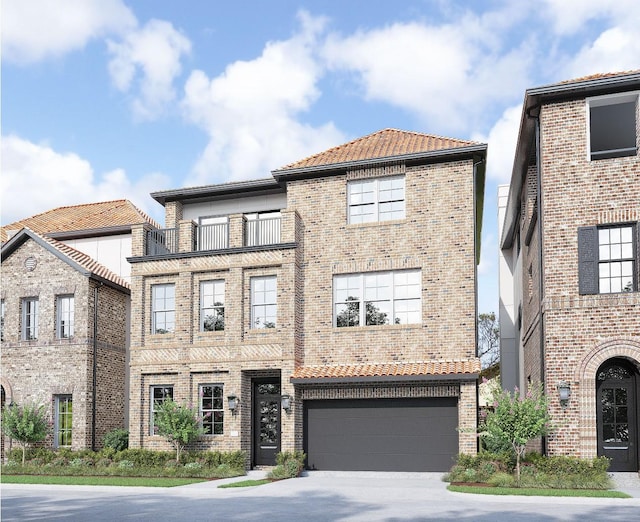 1139 Castellina Ln, Houston, TX 77055 - view of front of home featuring a garage, concrete driveway, brick siding, a balcony, and a tile roof