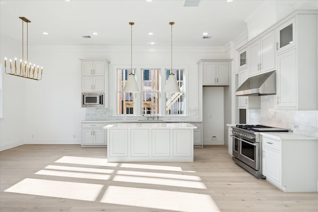 1139 Castellina Ln, Houston, TX 77055 - kitchen featuring extractor fan, stainless steel appliances, ornamental molding, backsplash, and glass insert cabinets