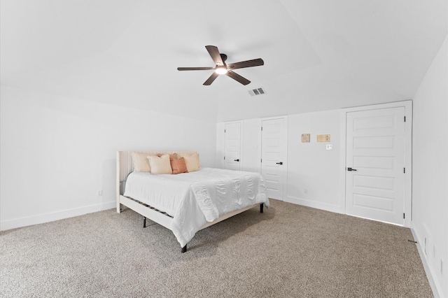 5507 Council Grove Ln, Houston, TX 77088 - carpeted bedroom with vaulted ceiling, baseboards, and ceiling fan