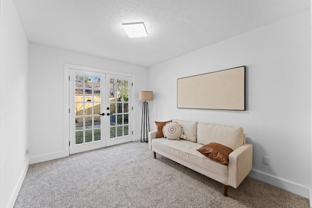 5507 Council Grove Ln, Houston, TX 77088 - sitting room featuring carpet floors, baseboards, french doors, and a textured ceiling