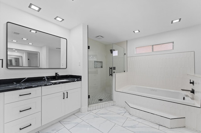 5507 Council Grove Ln, Houston, TX 77088 - full bathroom featuring vanity, a shower stall, a garden tub, and marble finish flooring