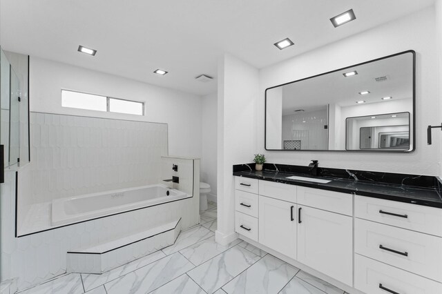 5507 Council Grove Ln, Houston, TX 77088 - bathroom with a bath, vanity, toilet, and marble look tile flooring