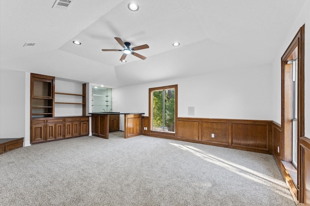 5507 Council Grove Ln, Houston, TX 77088 - unfurnished living room with recessed lighting, a ceiling fan, light carpet, a wainscoted wall, and vaulted ceiling