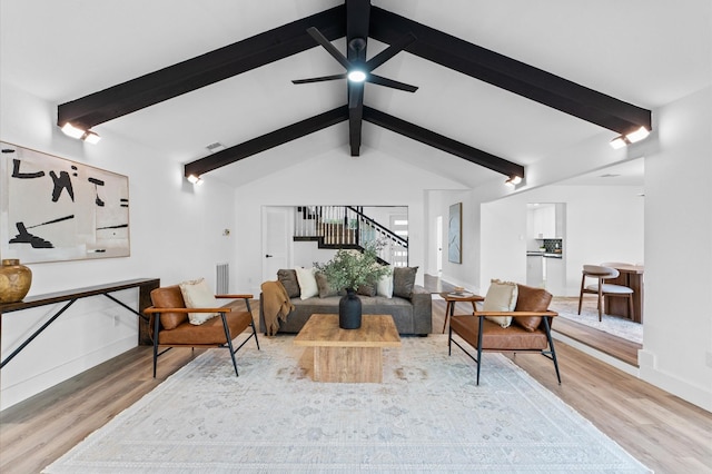 5507 Council Grove Ln, Houston, TX 77088 - living room featuring light wood-style flooring, baseboards, stairway, and a ceiling fan