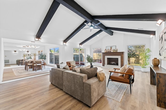 5507 Council Grove Ln, Houston, TX 77088 - living room with healthy amount of natural light, light wood-type flooring, a fireplace, and ceiling fan