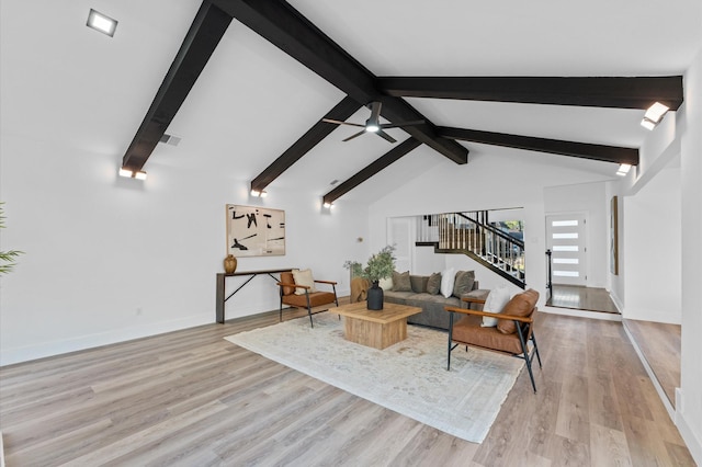 5507 Council Grove Ln, Houston, TX 77088 - living area featuring stairway, light wood-style floors, baseboards, and a ceiling fan