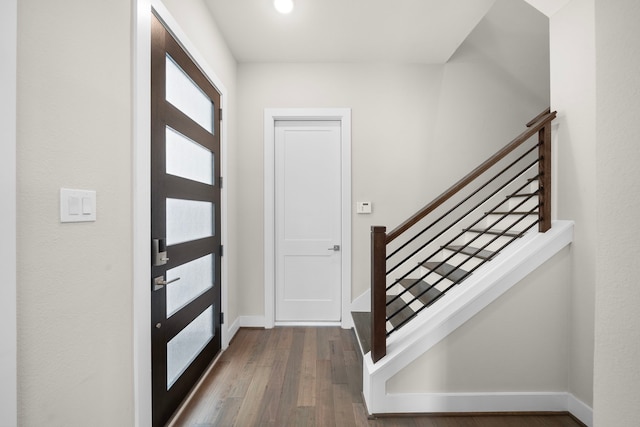 4509 Whitney Park Way, Houston, TX 77022 - entrance foyer featuring dark wood-style floors, baseboards, and stairs