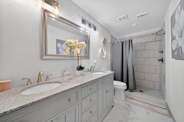 3363 Deer Ledge, Caldwell, TX 77836 - full bathroom with a tile shower, double vanity, toilet, and marble finish floors