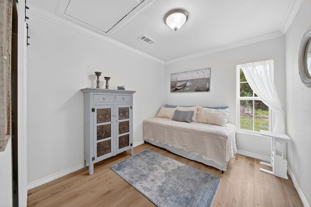 3363 Deer Ledge, Caldwell, TX 77836 - bedroom with light wood-style flooring, crown molding, and baseboards