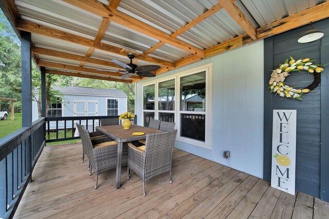 3363 Deer Ledge, Caldwell, TX 77836 - deck featuring outdoor dining space, ceiling fan, and an outdoor structure