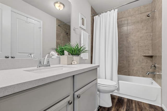 15818 Grampian Reach Ln, Humble, TX 77346 - bathroom featuring vanity, shower / tub combo with curtain, and wood finished floors
