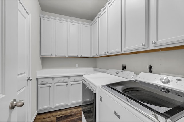 15818 Grampian Reach Ln, Humble, TX 77346 - laundry area featuring washing machine and clothes dryer, cabinet space, and dark wood-type flooring