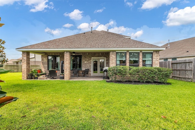 15818 Grampian Reach Ln, Humble, TX 77346 - back of property with french doors, roof with shingles, brick siding, a ceiling fan, and a patio area