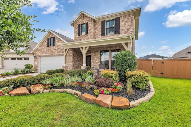 15818 Grampian Reach Ln, Humble, TX 77346 - view of front of home with brick siding, covered porch, an attached garage, and a gate