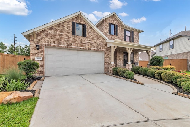 15818 Grampian Reach Ln, Humble, TX 77346 - traditional home featuring brick siding, concrete driveway, and a porch