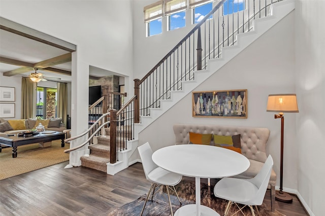 15818 Grampian Reach Ln, Humble, TX 77346 - dining area featuring a high ceiling, healthy amount of natural light, wood finished floors, stairway, and a ceiling fan