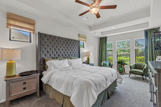 15818 Grampian Reach Ln, Humble, TX 77346 - bedroom featuring carpet floors, ceiling fan, and a raised ceiling