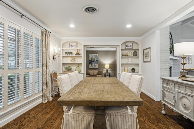7810 Pagewood Ln, Houston, TX 77063 - dining room with dark wood-type flooring, built in shelves, crown molding, and baseboards