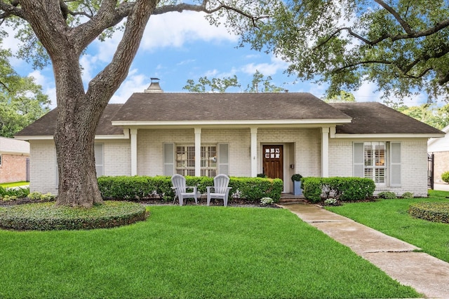 7810 Pagewood Ln, Houston, TX 77063 - ranch-style house featuring brick siding, a front lawn, covered porch, and a chimney
