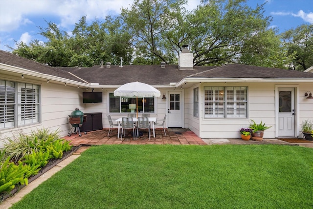 7810 Pagewood Ln, Houston, TX 77063 - back of house with a lawn, a chimney, a patio, and a shingled roof